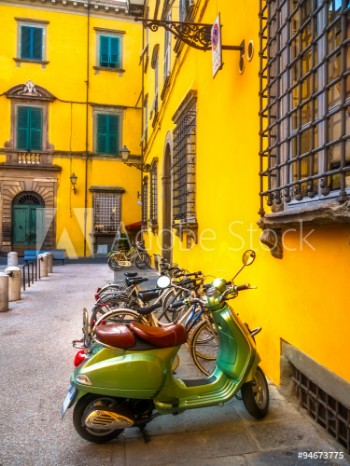 Picture of European motorbikes scooters vespas parked in Lucca Italy